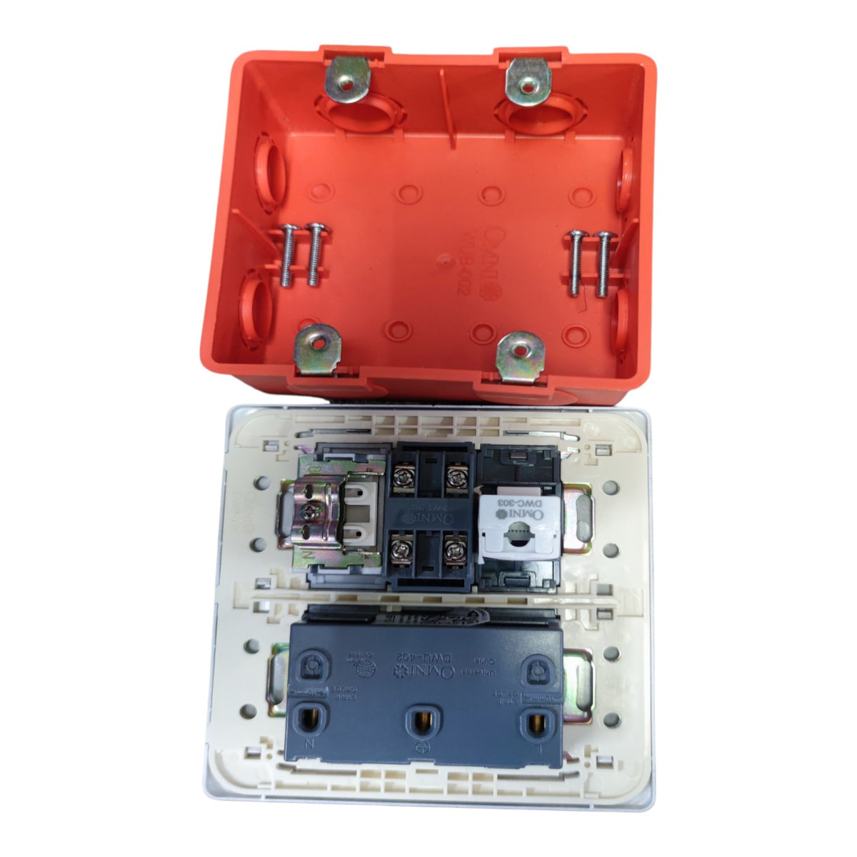 An electrical switch module shown open, with a bright orange upper housing lid positioned above a clear lower faceplate containing internal components including a dark blue terminal block and metal screws, photographed on a white background.