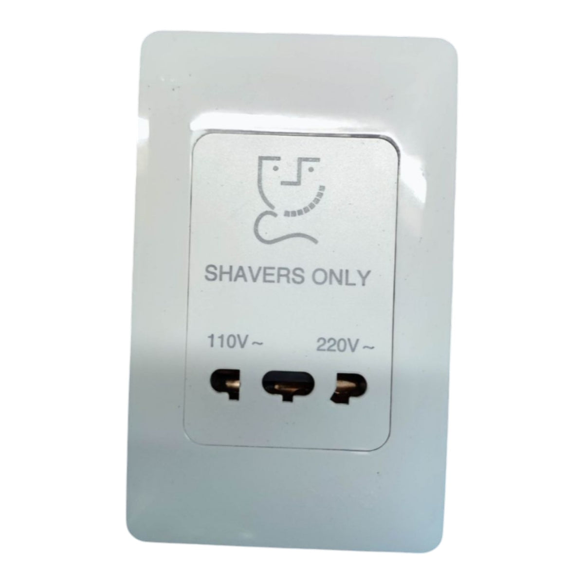 A white wall-mounted power adapter plug with a central label reading 'SHAVERS ONLY' and showing 110V~ and 220V~ markings, photographed on a plain white background.