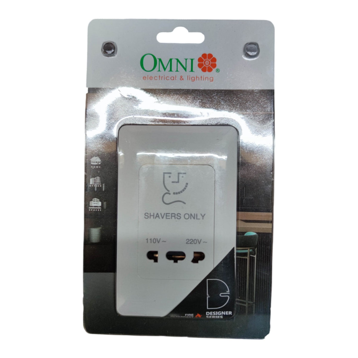 An Omni electrical and lighting shaver-only 3-pin wall adapter in its original retail blister packaging, featuring a silver adapter with black outlets and a black and silver backing card.