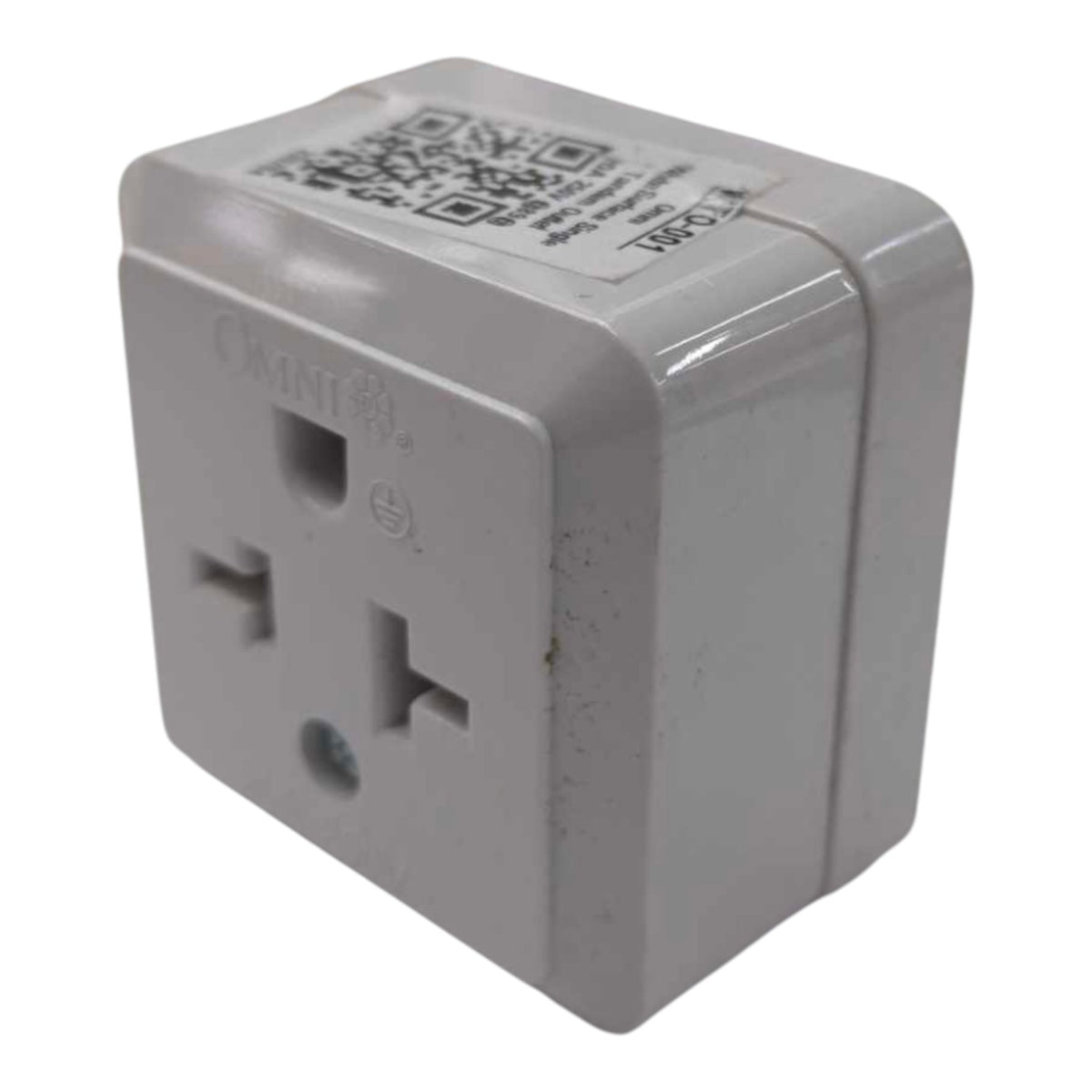 A white plastic OMNI international travel adapter with a US outlet, shown on a plain white background.