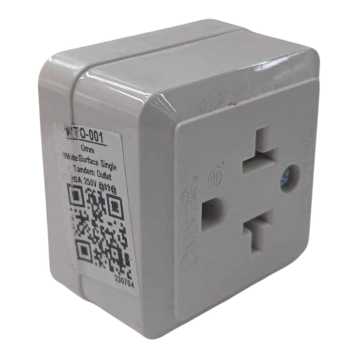 A white plastic twin-deckled single tandem outlet travel adapter with a product label on the side, shown against a plain white background.