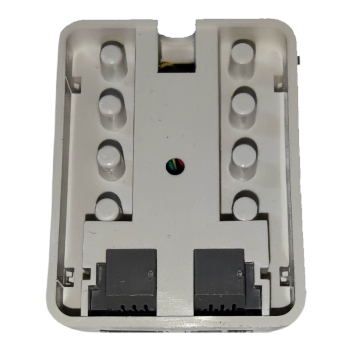 A white plastic wall-mount bracket or backplate with two black connector sockets at the bottom and a small colored ring near the center, shown on a plain white background.