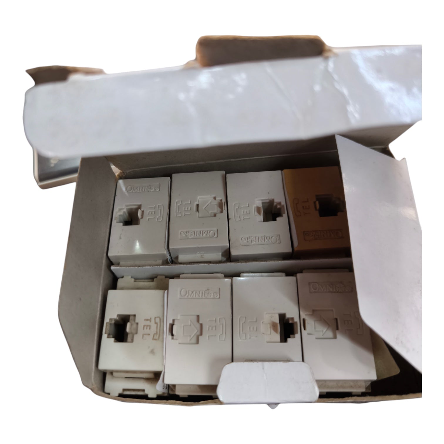 A box of vintage beige RJ45 network jack wall plates, shown with the cardboard lid open against a white background.