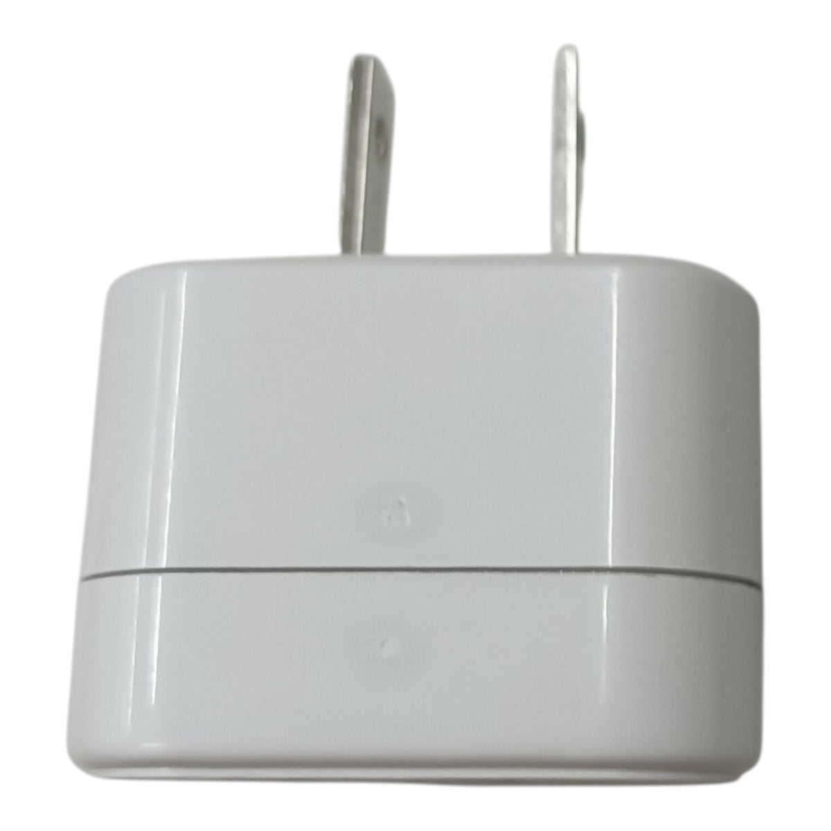 A white plastic wall charger adapter with two flat metal prongs, shown against a plain white background.