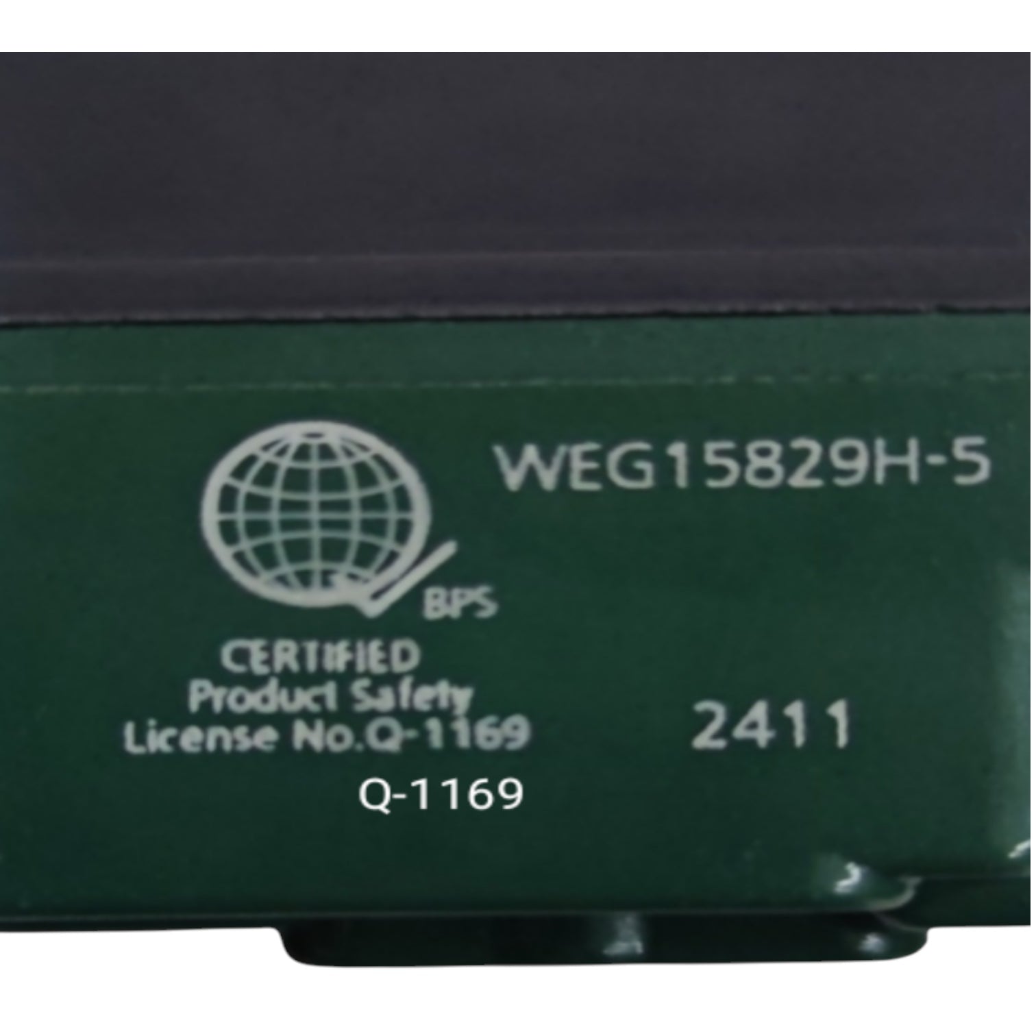 Close-up of a dark green industrial electronic module with white printed text and certification details, including 'WEG15829H-5', 'BPS Certified Product Safety', and '2411'.