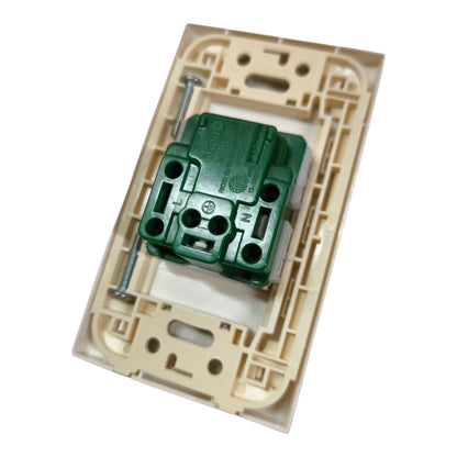 A close-up of a beige plastic electrical switch plate or socket cover with a green terminal block connector and a silver screw visible, isolated on a white background.