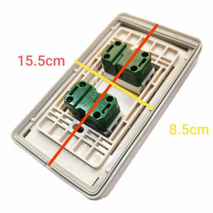A two-gang wall switch panel with green terminal blocks on a beige plastic backplate, overlaid with red and yellow measurement lines and text indicating dimensions 15.5cm and 8.