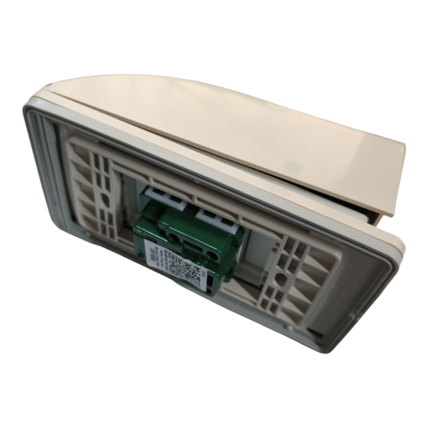 A close-up of a beige plastic cover or lid with a gray inner frame and a small green electronic component attached, shown on a plain white background.