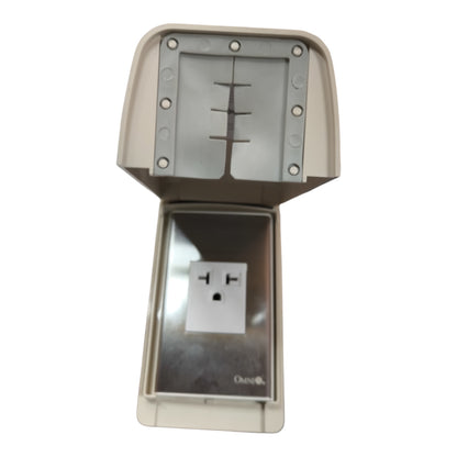 An outdoor waterproof electrical outlet cover with an open top hood, showing a silver metal outlet plate and a white grounding pin cover, on a plain white background.