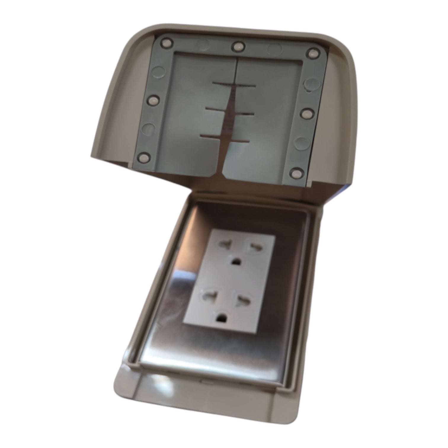 A waterproof outdoor electrical outlet cover with its lid open, showing a white four-pin socket inside a metallic silver tray and beige outer housing.