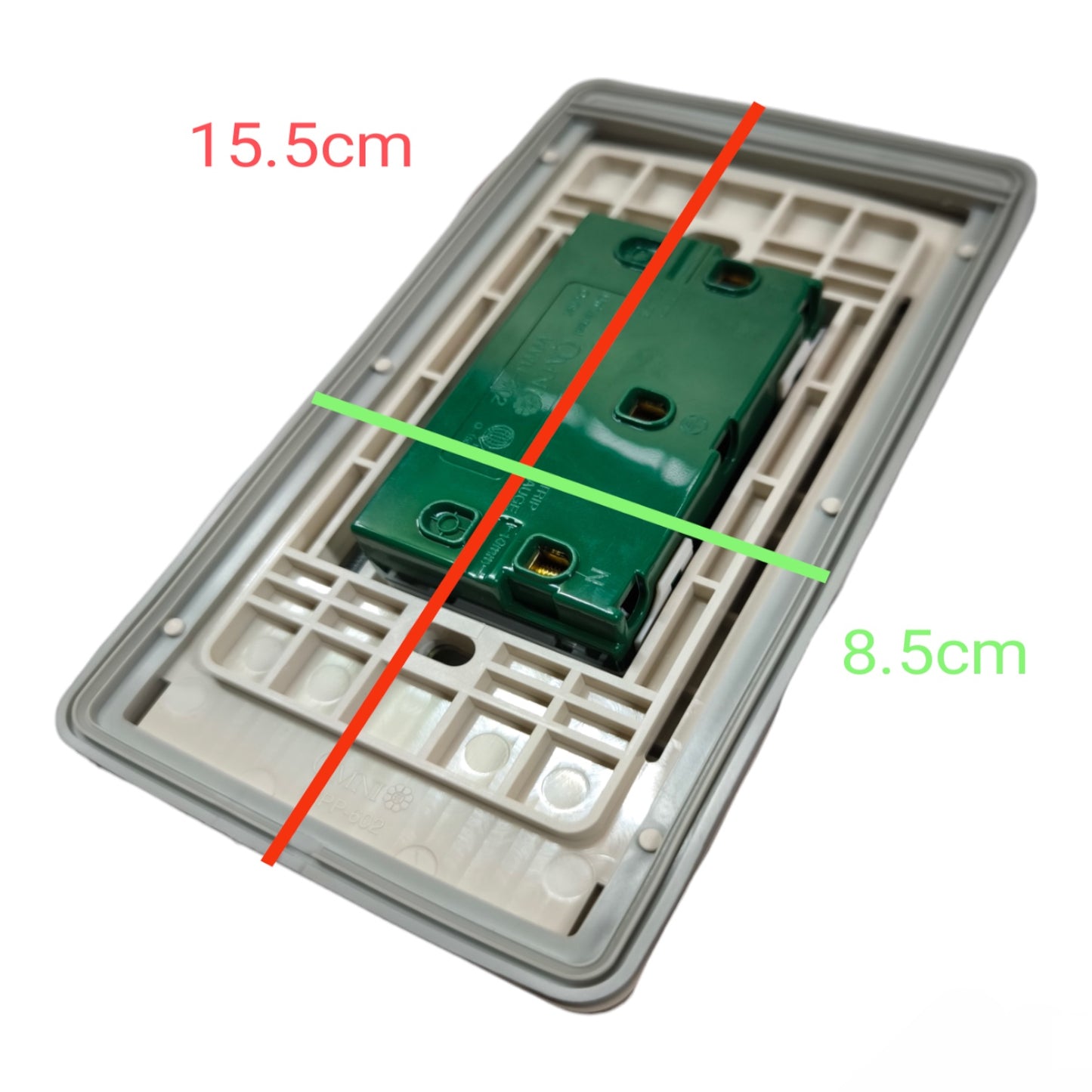 A rectangular wall switch plate or electrical backplate shown on a white background with red and green measurement lines and text indicating dimensions 15.5cm, 8.