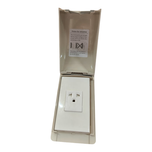 An outdoor waterproof electrical outlet cover with an open beige plastic hinged lid showing a white US two-prong outlet underneath, on a solid white background.