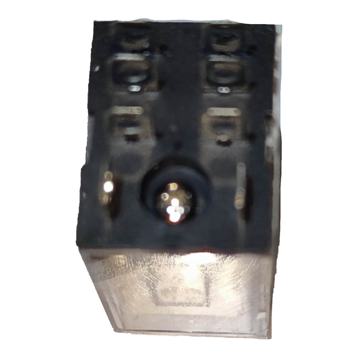 A small black plastic electrical component or connector with a clear plastic cover on the front, photographed against a plain white background.