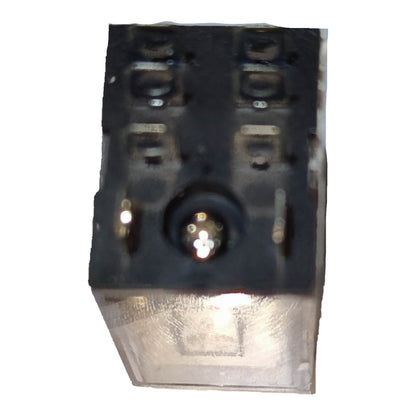 A small black plastic electrical component or connector with a clear plastic cover on the front, photographed against a plain white background.