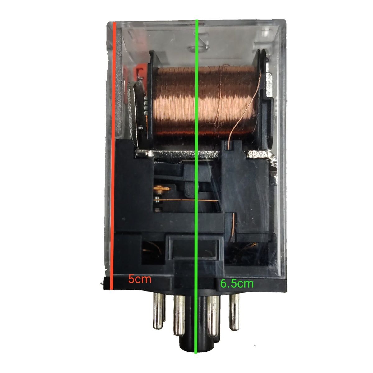 A transparent plastic electrical relay component with a copper wire coil, black internal structure, and metal pins at the bottom, shown on a white background with green and red dimension lines indicating 6.5cm and 5cm.