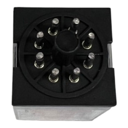 A black electrical relay component with a circular multi-pin connector face and a metallic base, shown on a plain white background.