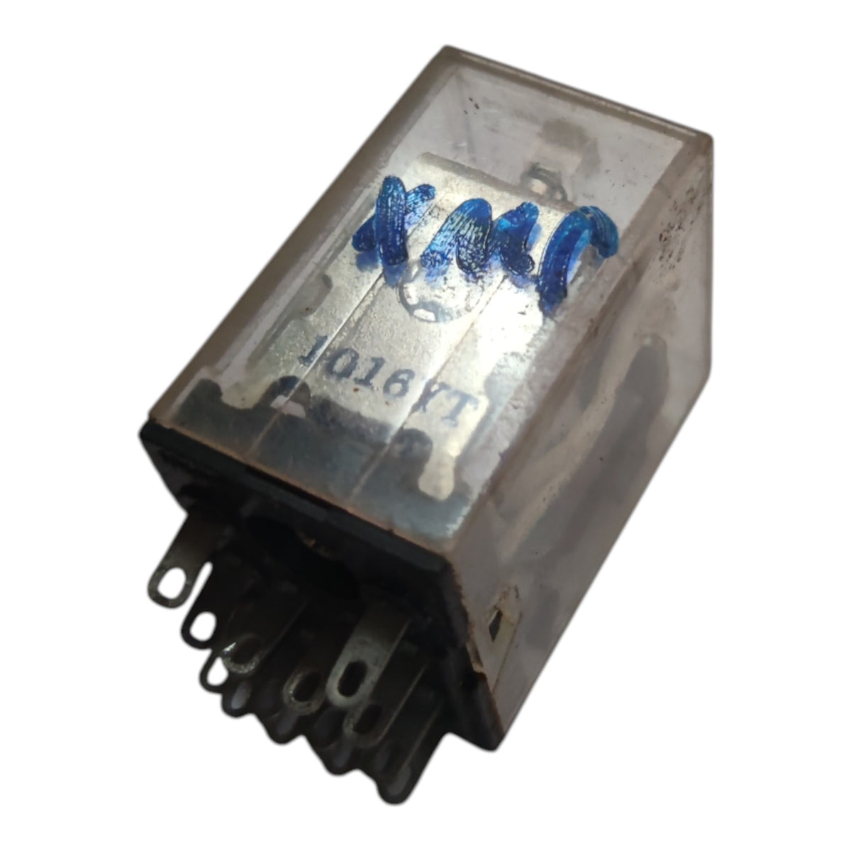 A small electrical relay with a clear plastic housing, black metal base, and blue handwritten markings on a white background.