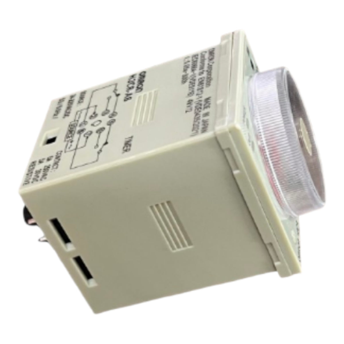 An industrial electrical timer relay unit with a beige plastic housing, printed circuit diagrams on the side, and a clear ribbed lens covering the front timer coil.