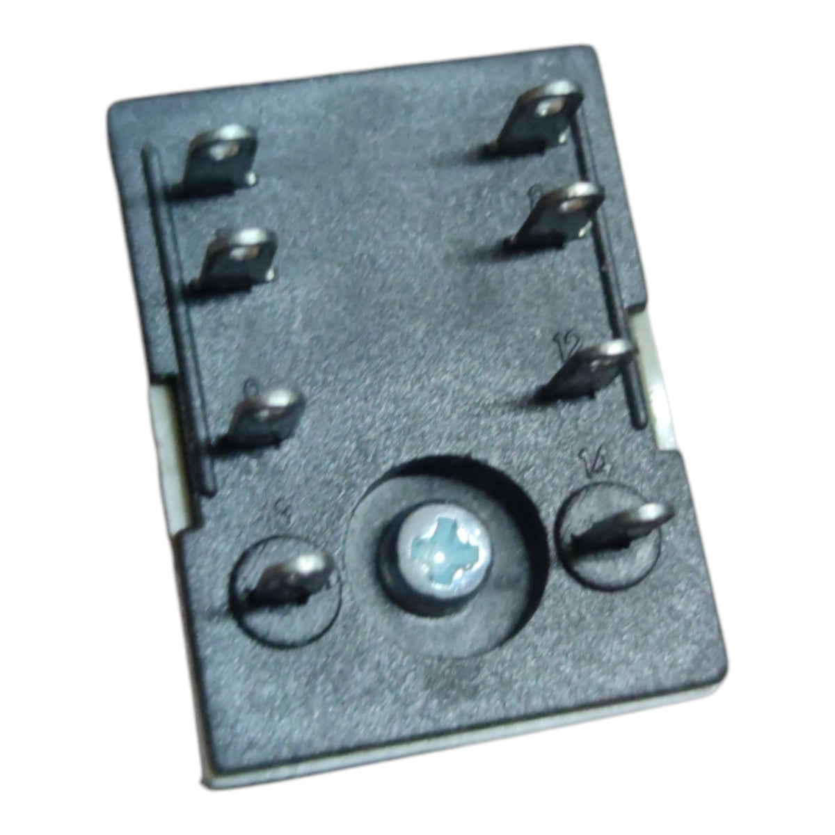 A small black electronic component with multiple metal pins and a central screw, photographed on a plain white background.