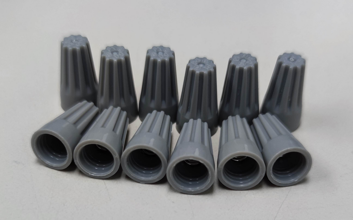 Gray Wire Nut Electrical Connector Caps arranged in two rows for electrical circuitry use