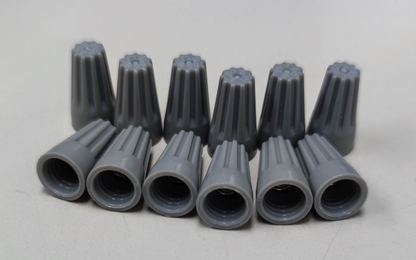Gray Wire Nut Electrical Connector Caps arranged in two rows for electrical circuitry use