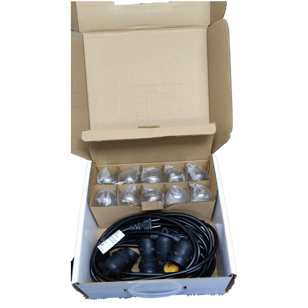 Open cardboard box containing garden hose and connectors on a white background
