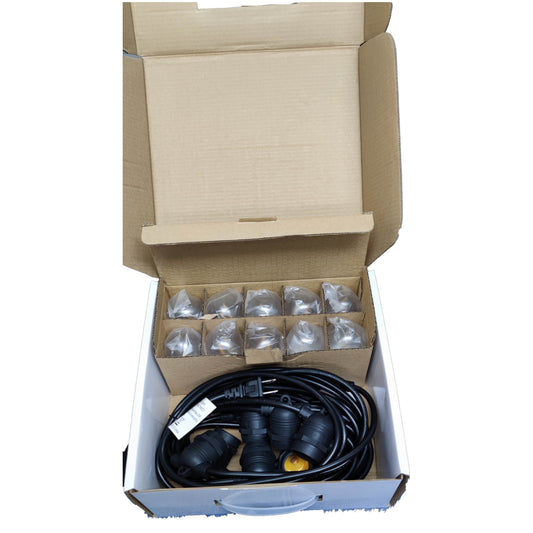 Open cardboard box containing garden hose and connectors on a white background