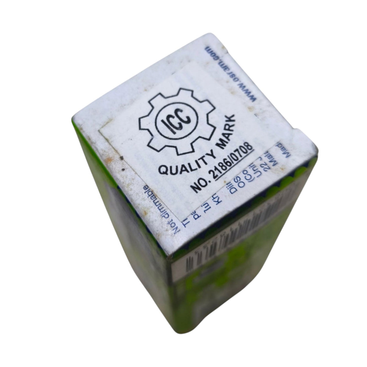A small rectangular product box shown at an angle on a plain white background. The top is mostly white with a printed black 'ICC Quality Mark' logo and text, and the sides are green with a barcode visible.