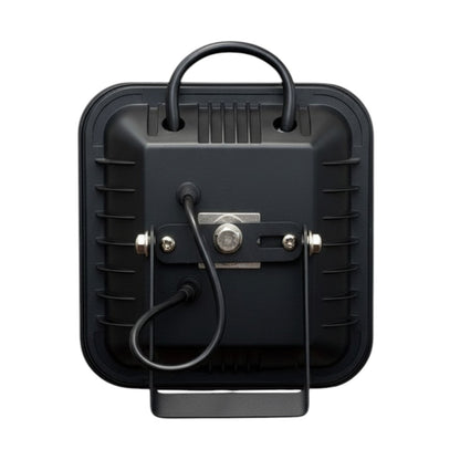 The back view of a black square portable light with a carrying handle, power cord, and mounting bracket, shown on a plain white background.
