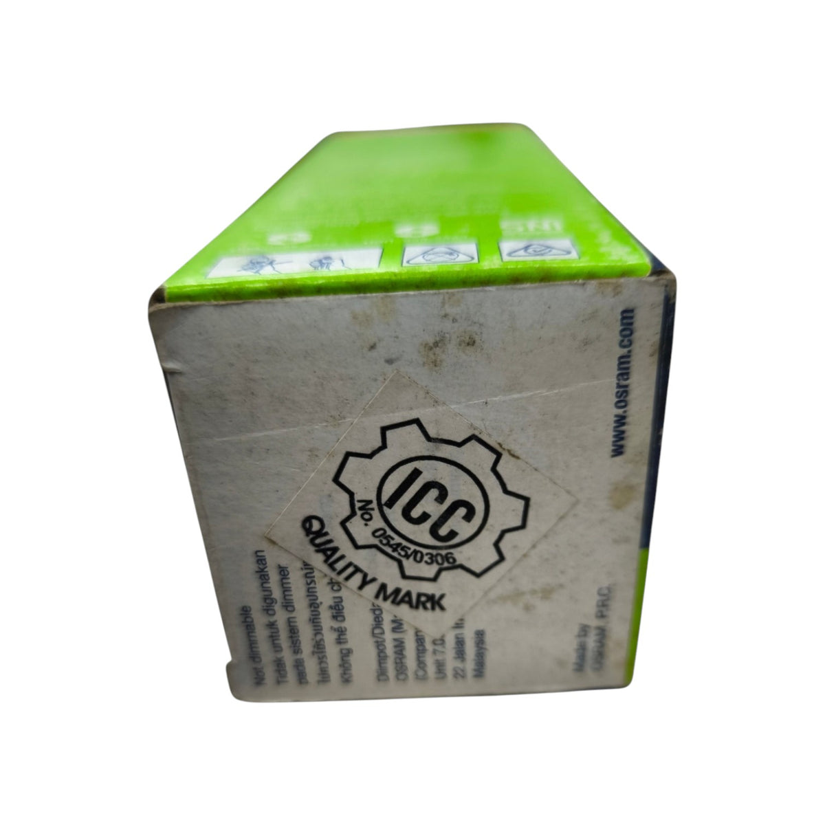 A square cardboard box with a bright lime green top and a dirty off-white side panel featuring an ICC Quality Mark logo and website text.