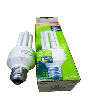 An Osram compact fluorescent light bulb next to its green and white retail packaging box, set against a plain white background.