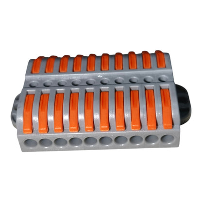 Gray and orange plastic component on a white background