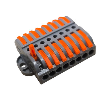 Gray and orange plastic component on a white background