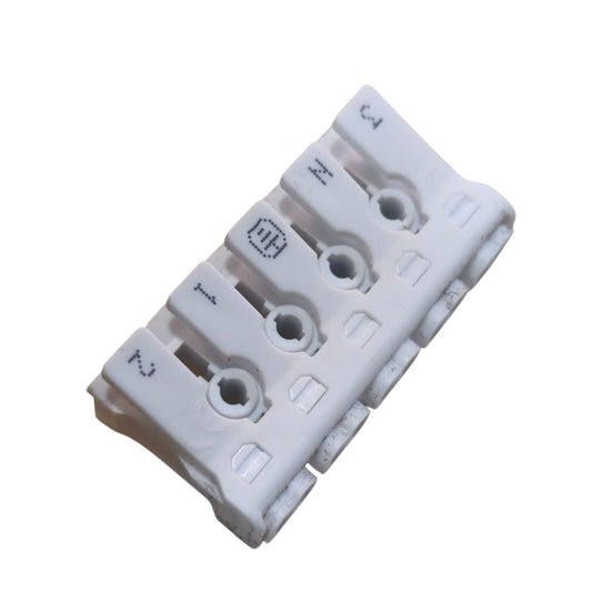 White plastic component with multiple holes on a white background