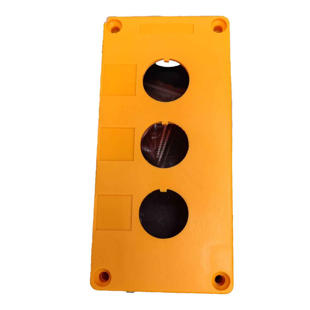 An orange plastic electrical junction box cover with three circular openings for cables, shown on a plain white background.