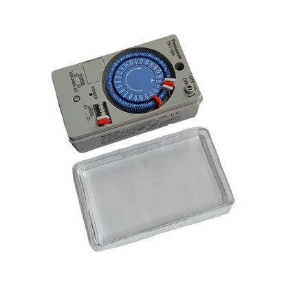 Electrical timer switch with a clear plastic cover on a white background
