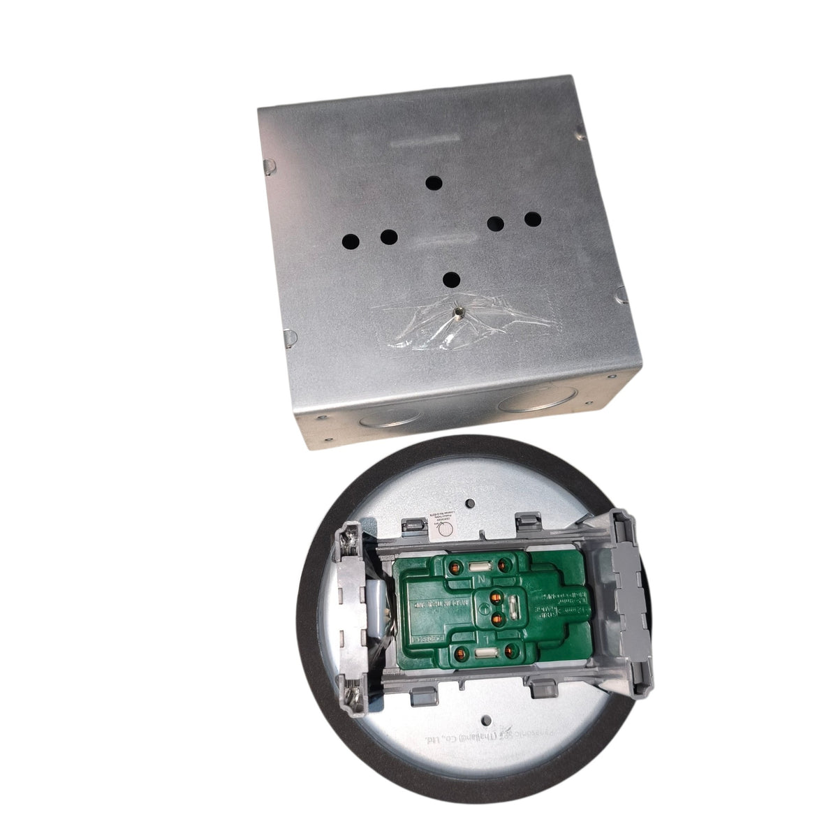 A square metal electrical junction box with a circular recessed base, shown from top and bottom views on a white background.