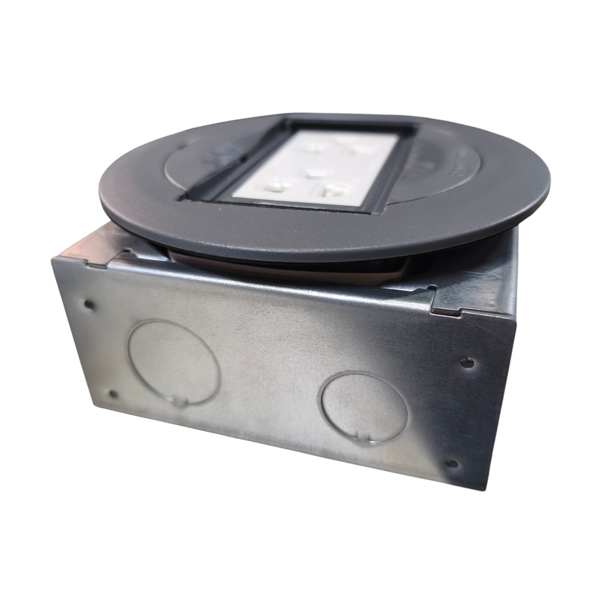 A square metal electrical junction box with a circular black top cover, featuring two round entry holes on the front and a white plastic insert visible in the center of the lid, isolated on a white background.