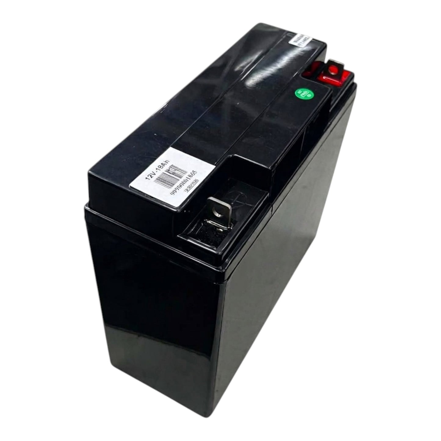 A black rectangular lead-acid battery with a white barcode label, a red terminal cap, and a green polarity indicator, photographed on a white background.