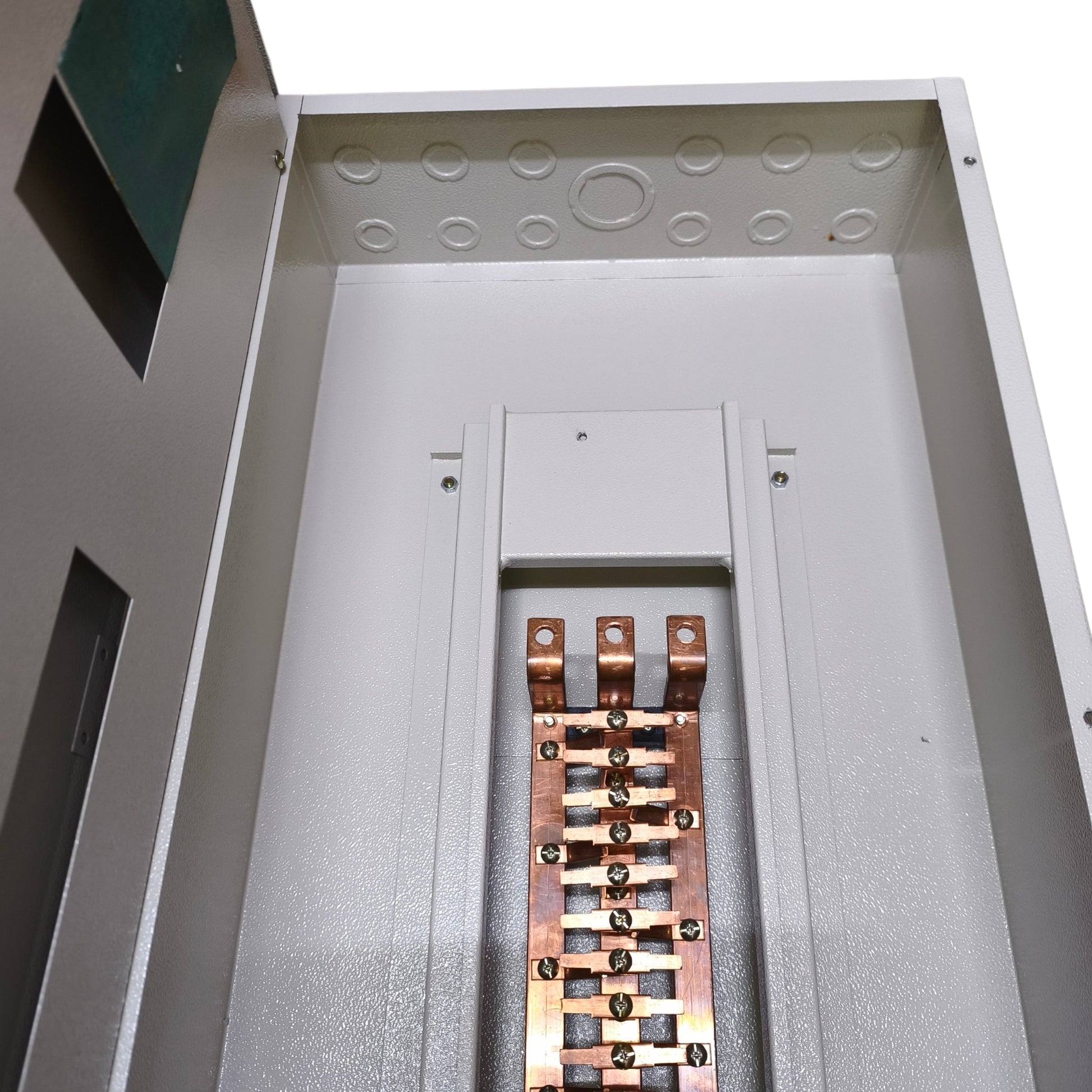 Close-up of the interior of a metal electrical cabinet or distribution box, showing a copper busbar terminal assembly mounted on a white interior panel.