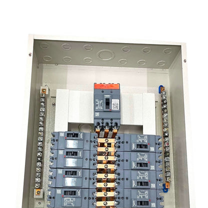 An open electrical distribution panel showing multiple gray circuit breakers arranged in rows, with copper bus bars connecting them and terminal blocks on both sides, photographed against a white background.