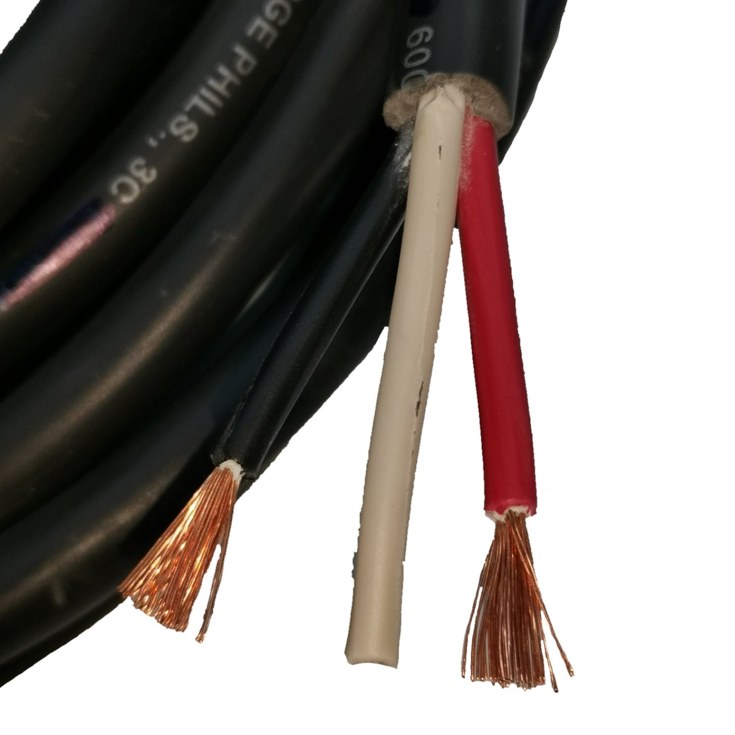 Close-up of black, beige, and red cables with exposed copper wires on a white background