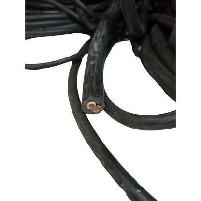 Close-up of a coiled black cable on a white background