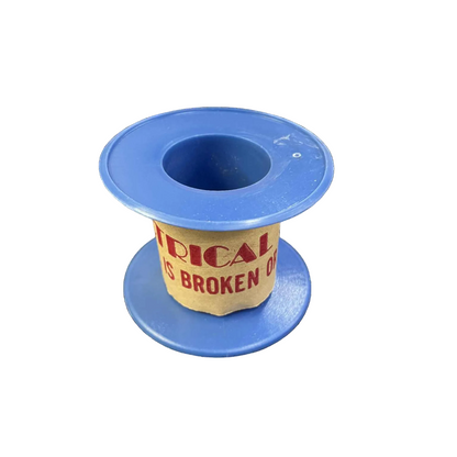 Blue spool with a yellow label on a white background