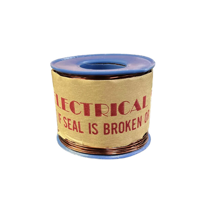 Spool of electrical tape with warning label on a white background