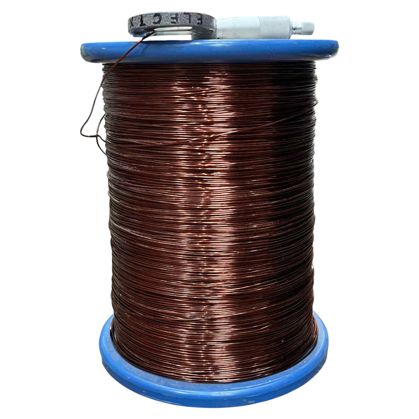 Spool of copper wire on a white background