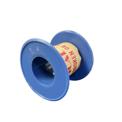 Blue spool with a roll of paper on a white background