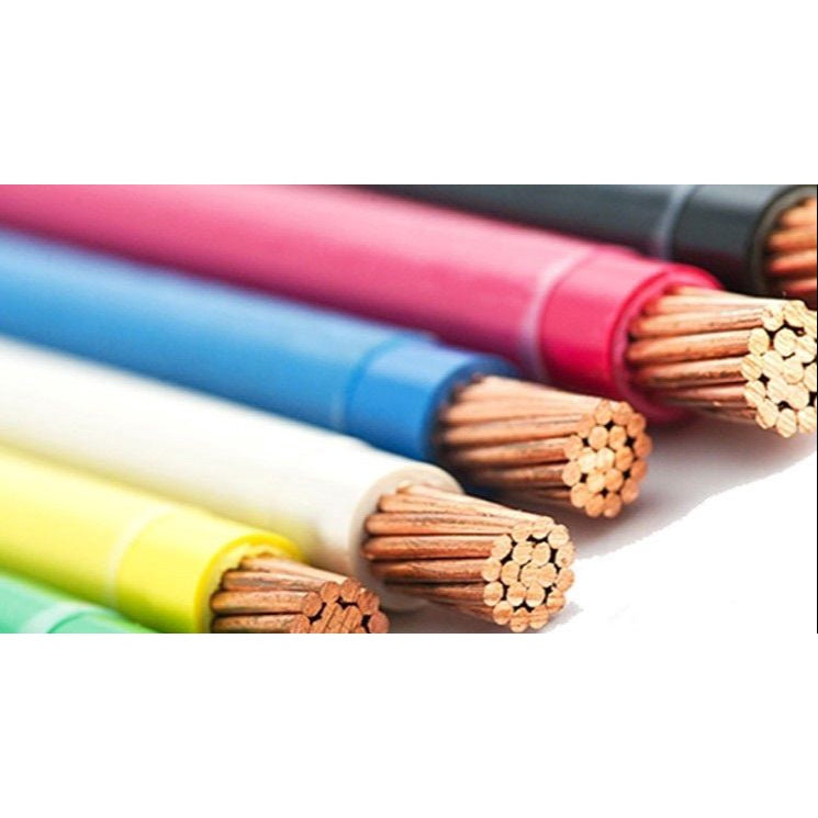 Close-up of several colorful cables or wires arranged diagonally, showing their exposed copper-toned strands at the ends, on a white background.