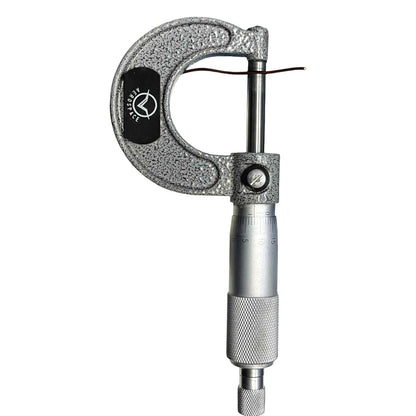 Metallic micrometer on a white background