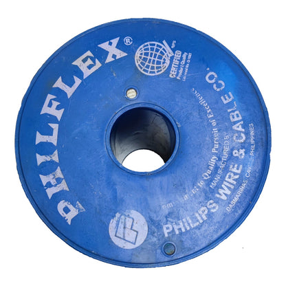 A blue circular spool of Philips Wire & Cable Co. PHILFLEX wire, featuring white printed branding and specifications on a clean white background.